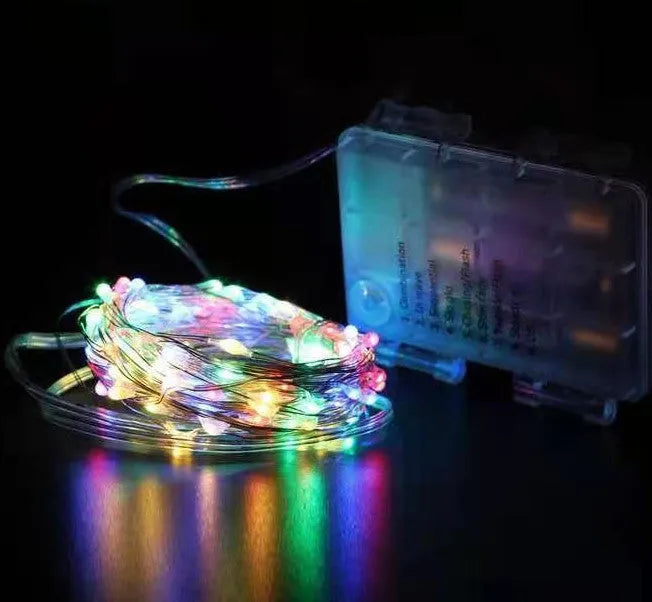Copper wire decorative string light with 120 bulbs on a 12-metre cable, showing battery box and colour options.