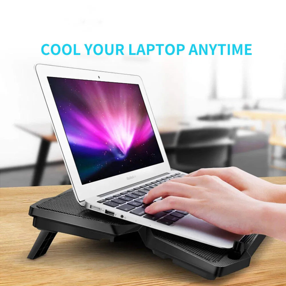 Blue LED desktop cooling base with four fans and USB ports for PC temperature control