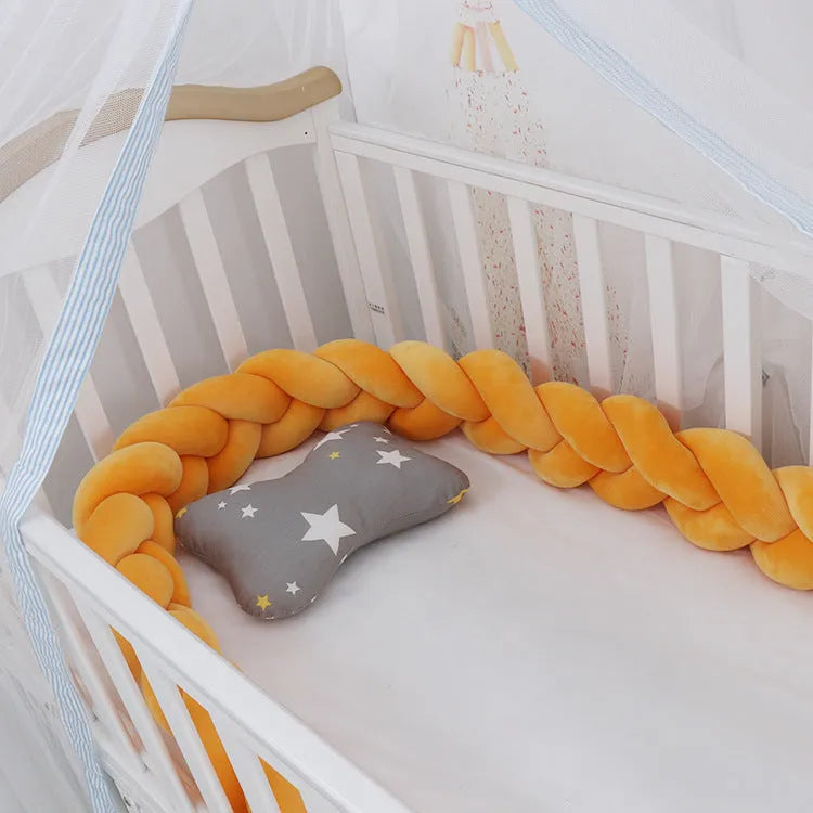 Baby crib bumper protector in spandex velvet, bent to show flexible shape, against a crib rail.