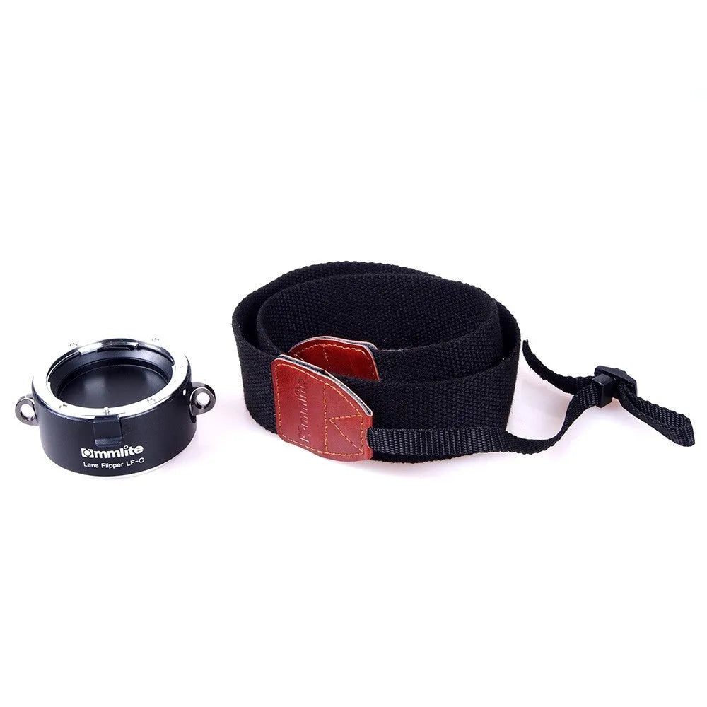 Aluminium alloy camera lens flipper holder for Nikon E-Mount with stainless steel buckle and cotton strap.