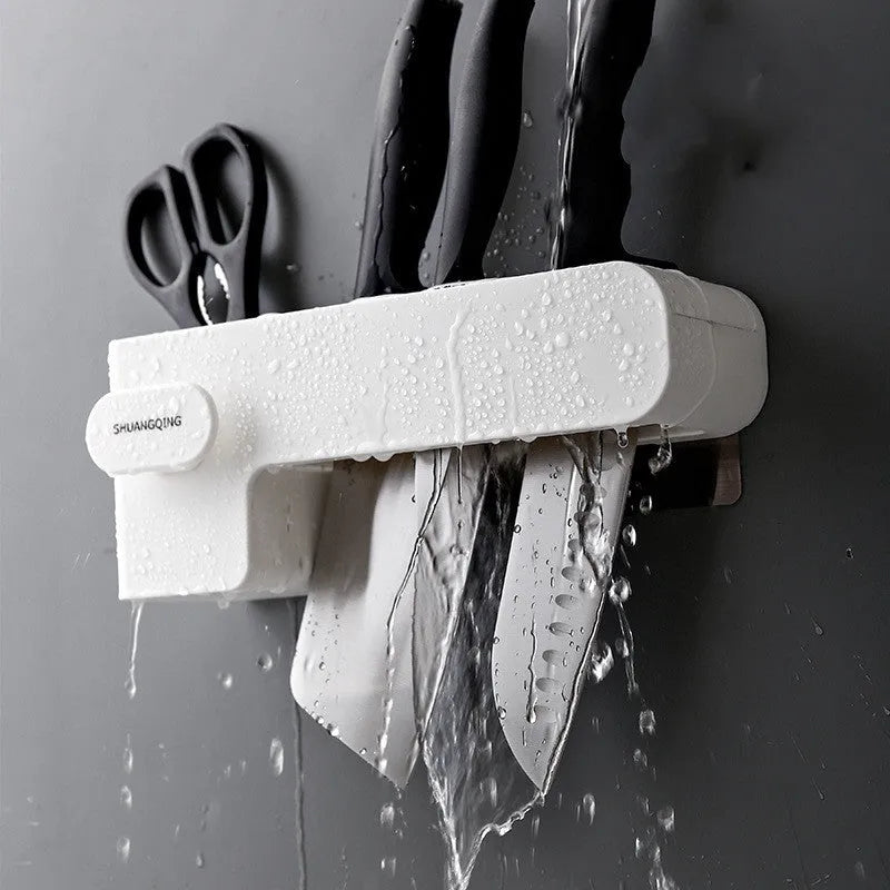 White plastic kitchen knife storage block with modern simple design on countertop