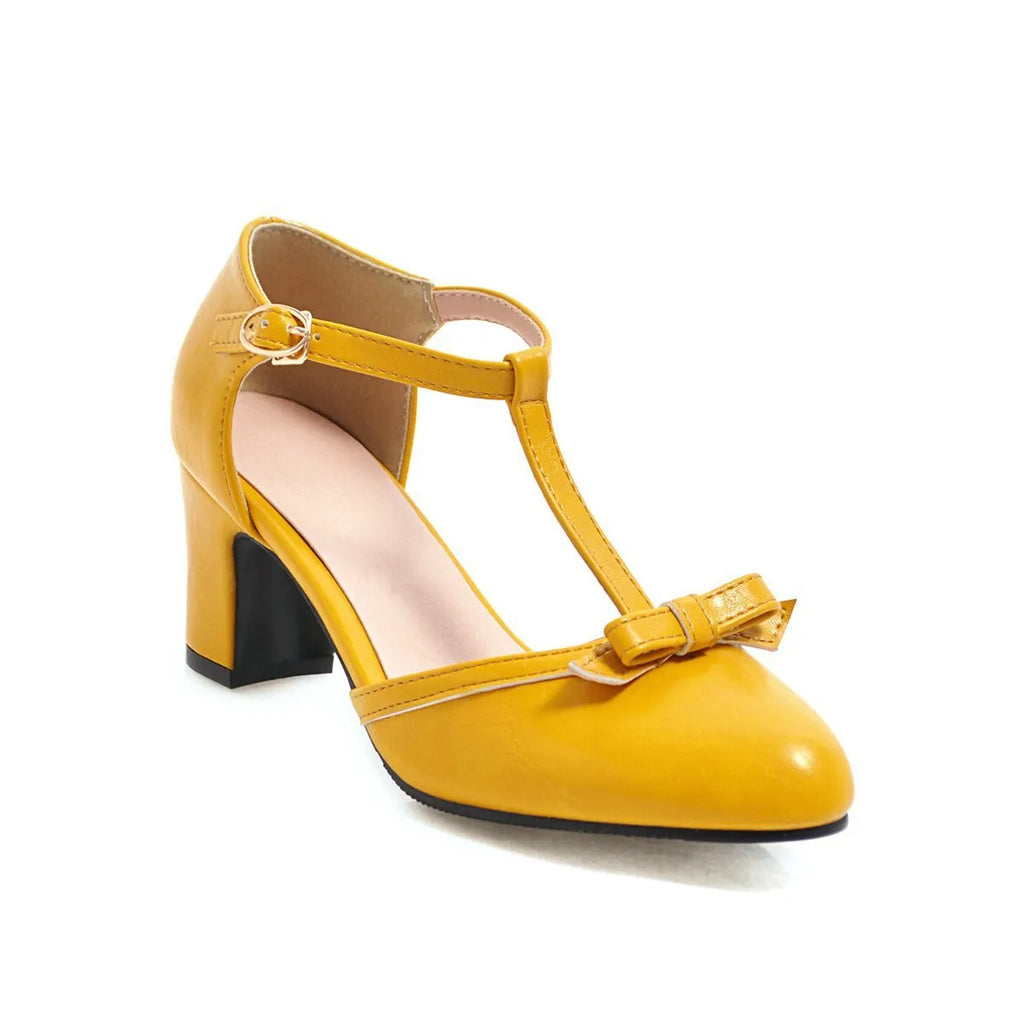 Women's apricot chunky heel sandals with a buckle strap and bow detail on a hollow-out PU upper.