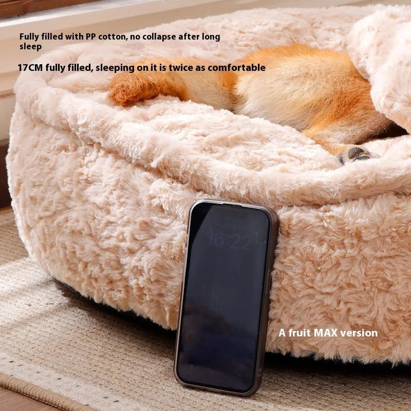 Round nest-style pet bed with a removable washable cover in a milk tea colour.