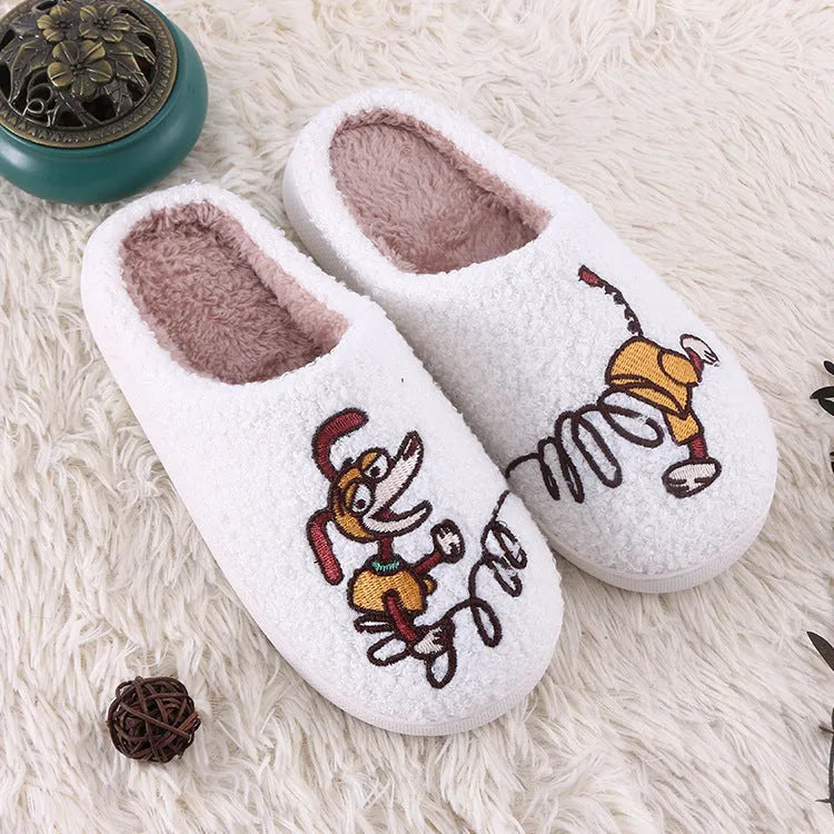 White fluffy slippers with cartoon patterns, rubber soles, and toe holder design