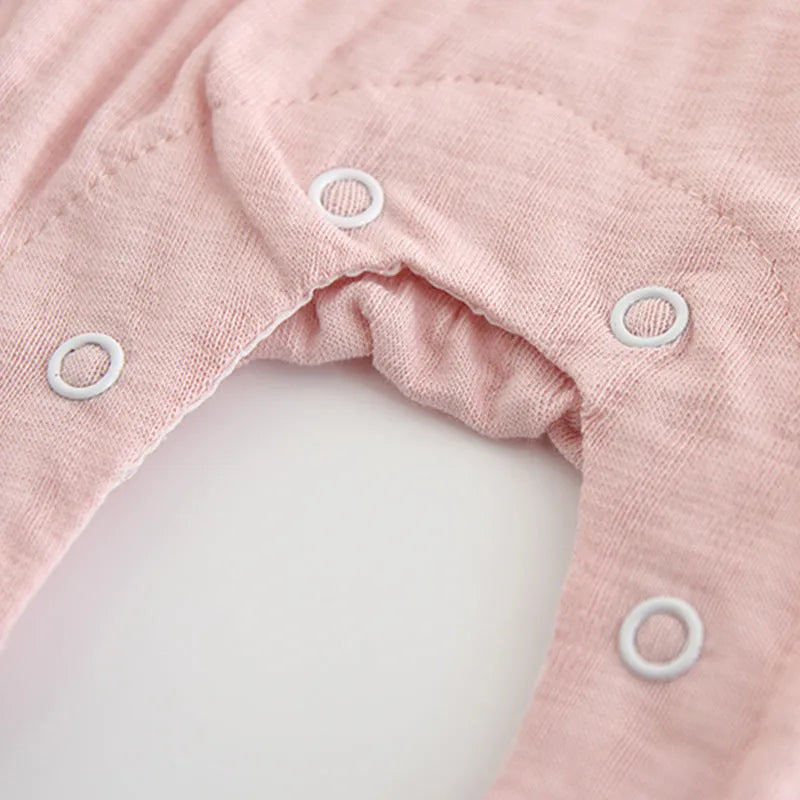 Pink long sleeve cotton jumpsuit for baby girl with single-breasted buttons