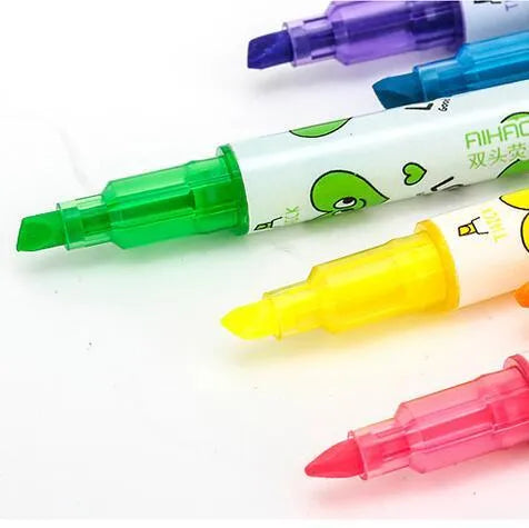 Set of six double-headed watercolour highlighter pens in pink, orange, yellow, green, blue, and purple.