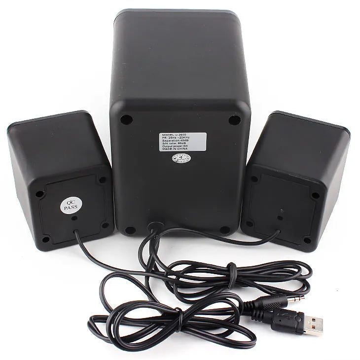 Green USB-powered 2.1 channel computer speaker with colourful LED lighting on desktop