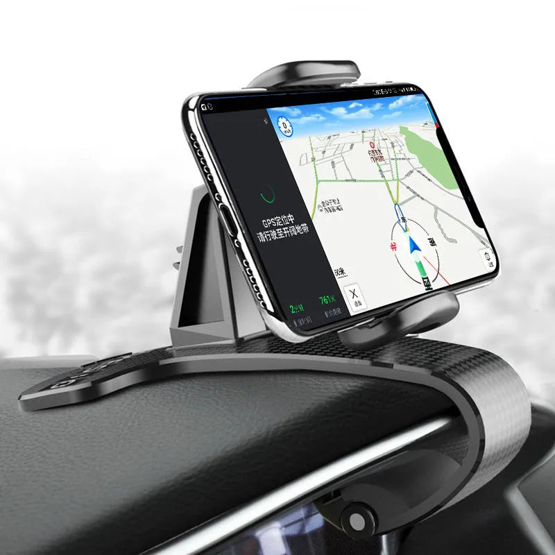 Black 360-degree rotating car phone holder with an adjustable width cradle on a car dashboard.