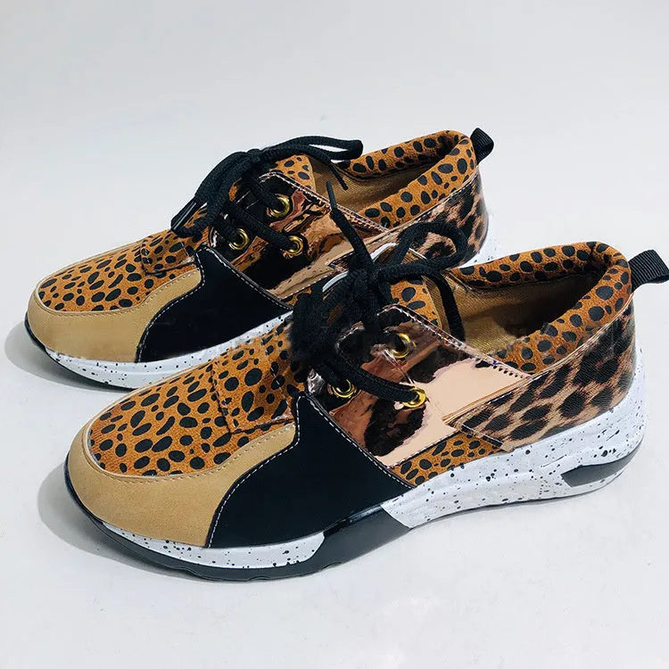 Women's suede casual flat sneakers with a wedge heel in leopard print.