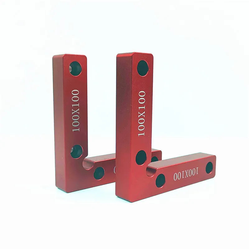 Aluminium alloy right angle woodworking positioning block on a workbench.