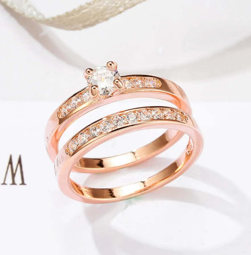 Rose gold ring with diamonds on copper base, available in sizes 5 to 12, shown on a neutral background