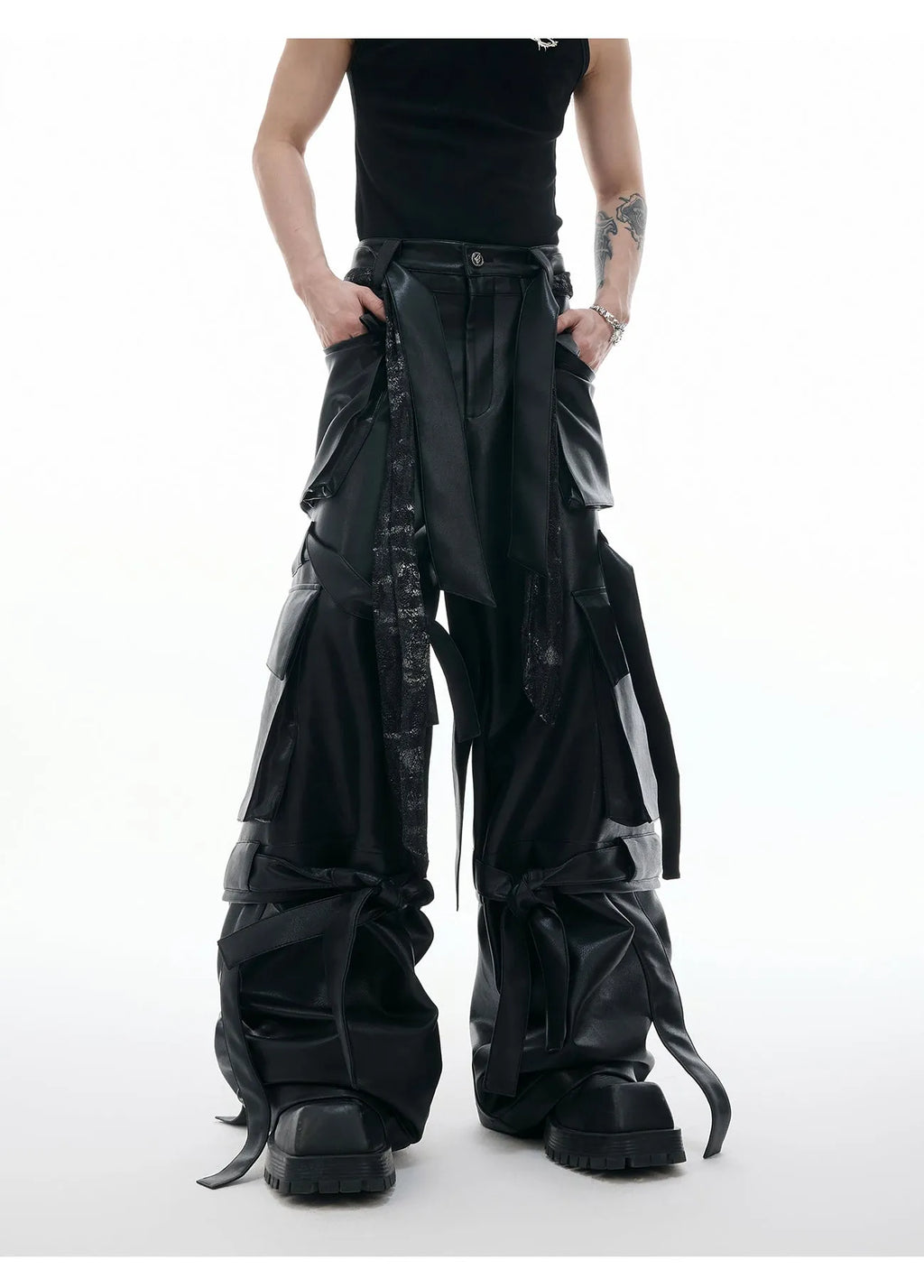 Black quilted leather pants with multiple pockets and decorative stitching ribbon details