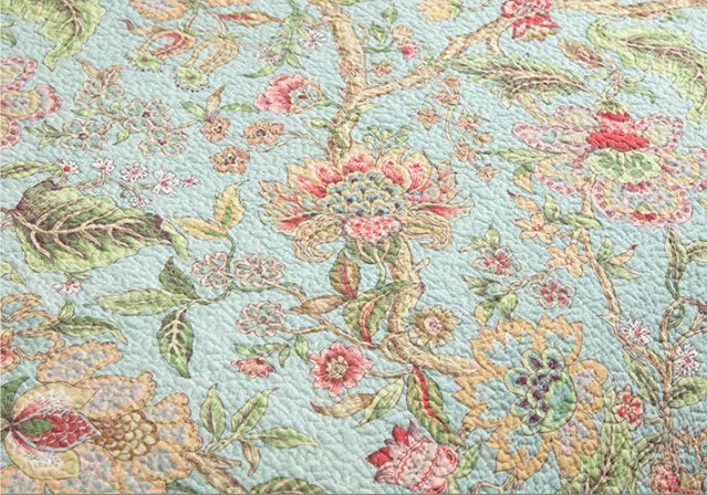 Blue American-style cotton bedspread with floral bird pattern, part of a 3-piece quilted set.
