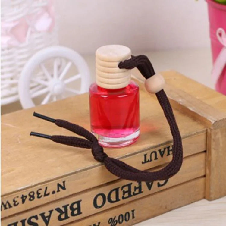 Glass bottle car air freshener hanging ornament with choice of six 55g scents.