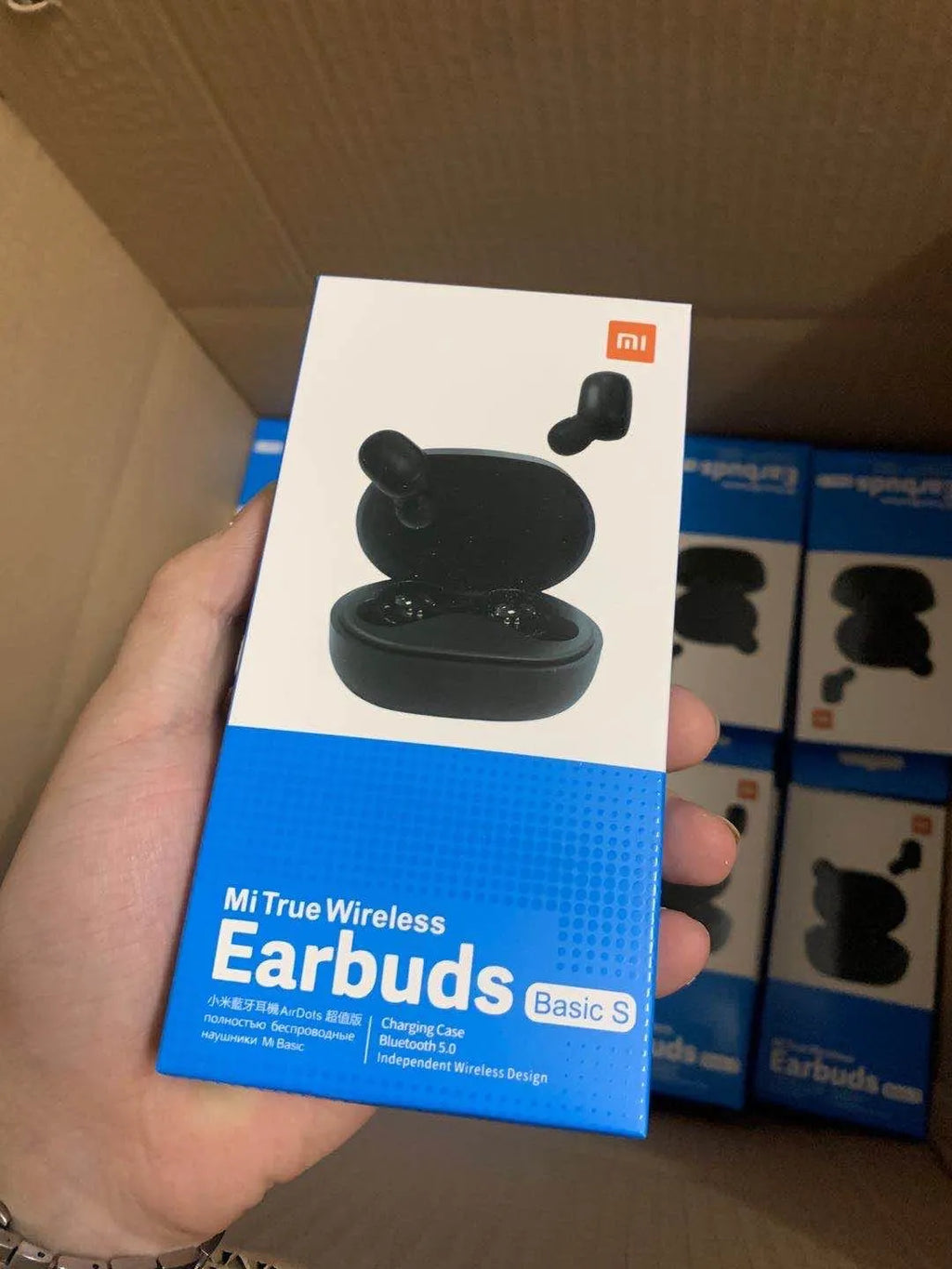 Redmi AirDots black true wireless Bluetooth headphones and charging case.