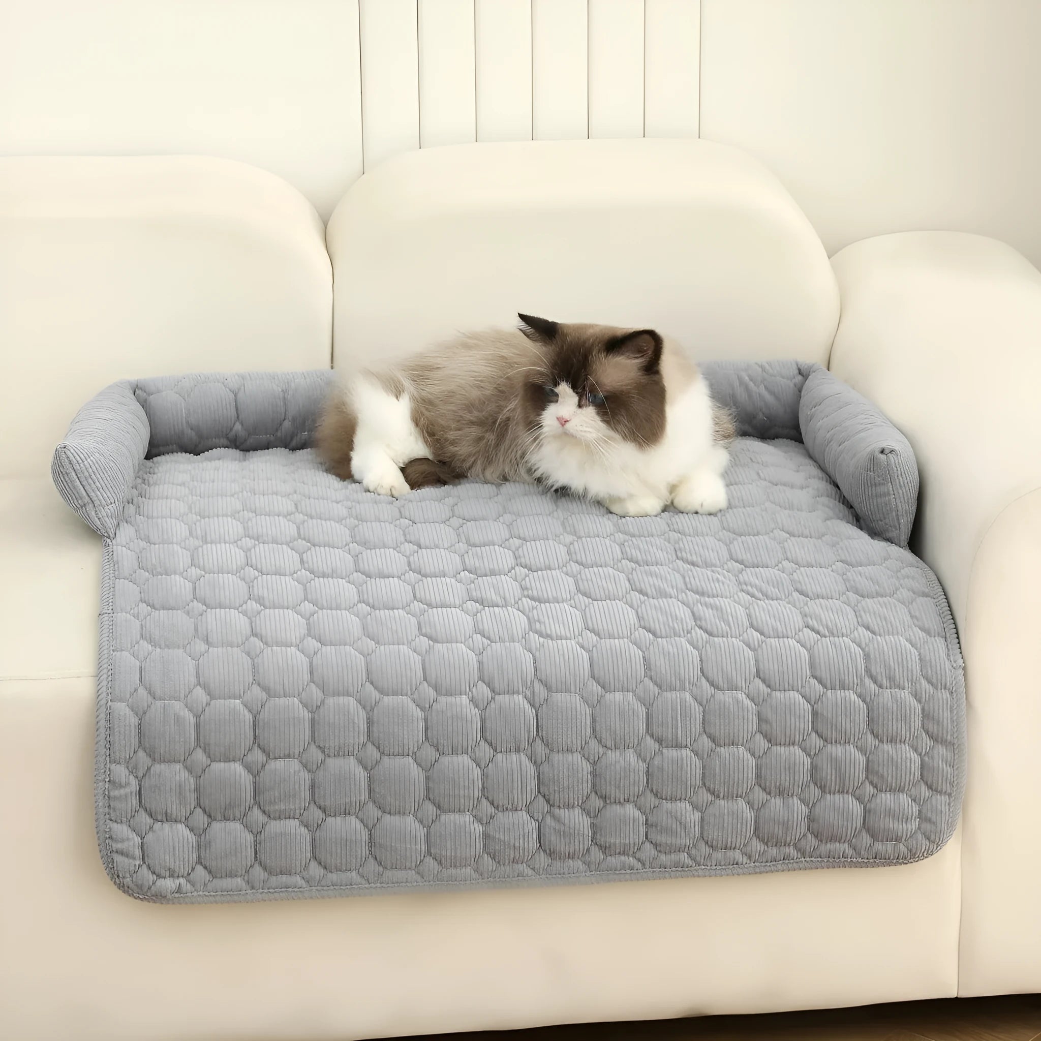 Thick corduroy pet bed mat with neck pillow in beige, 75x75cm, on a floor