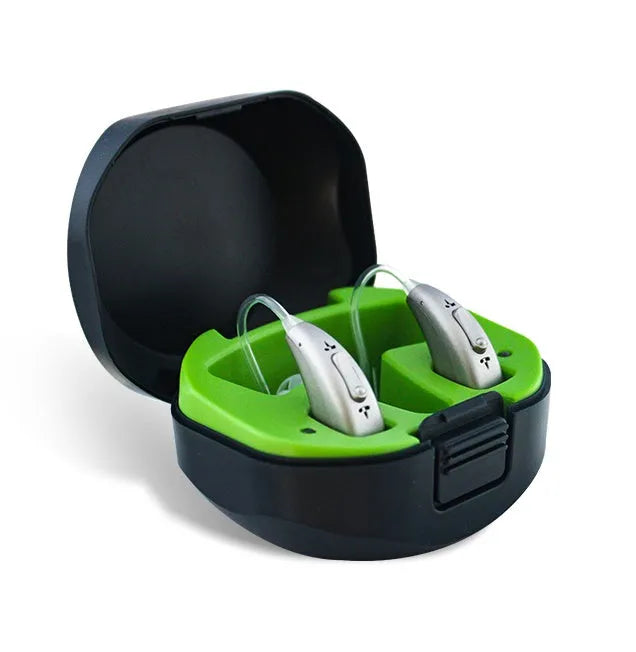 Wireless invisible rechargeable hearing aid with USB charging case on a table