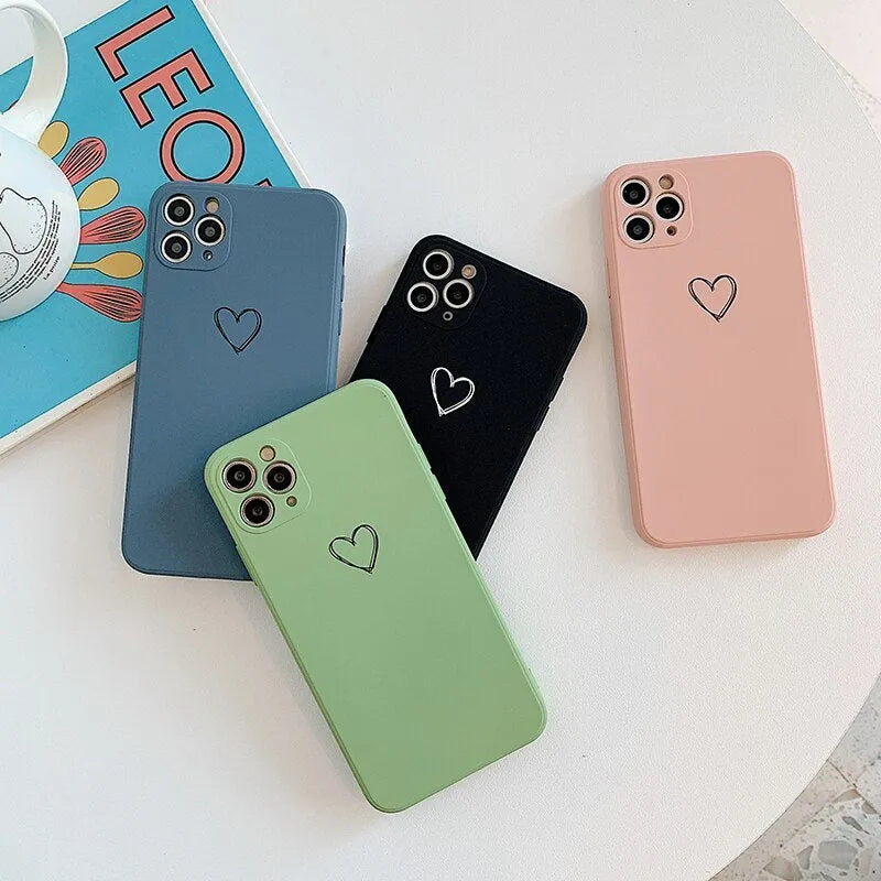 Solid colour silicone phone case for iPhone shown in black, green, grey, light green, pink, purple, red, and white options