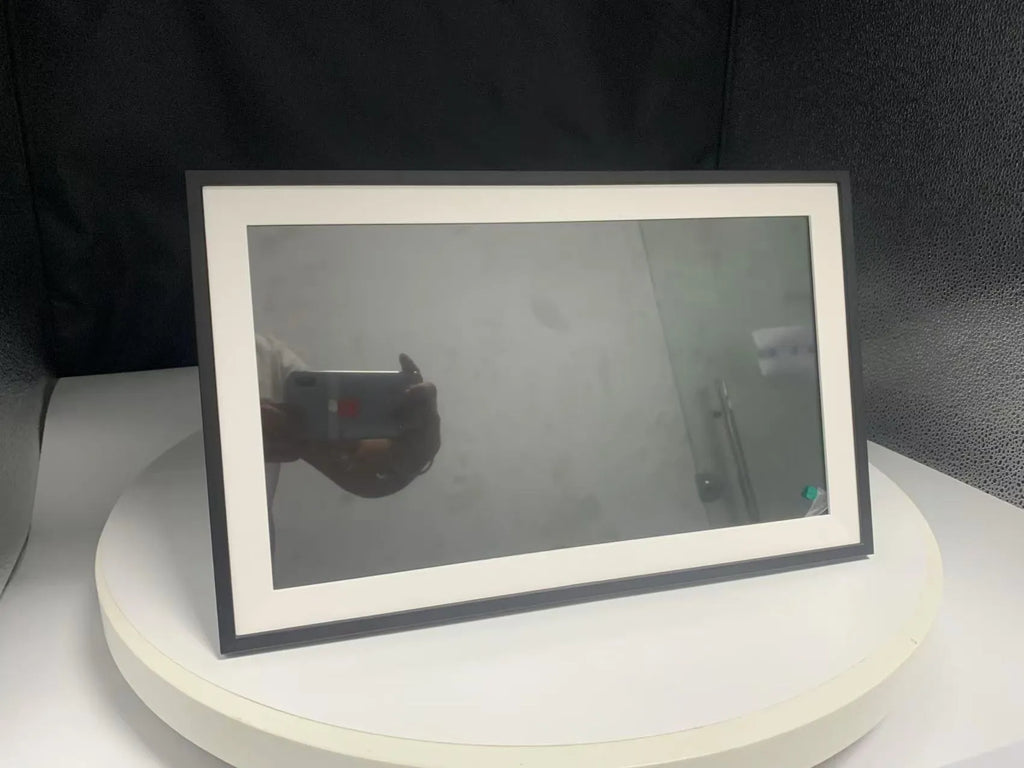 White 15.6 inch digital photo frame displaying family photos on full HD screen