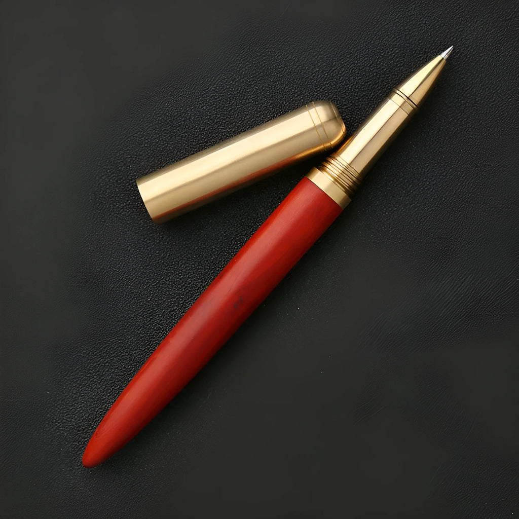Brass and solid wood signature pen showing wood grain and metal components