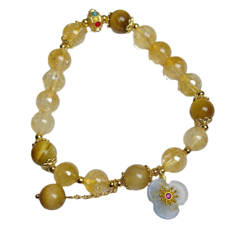 Women's citrine-coloured crystal bracelet with handcrafted flower tassel design
