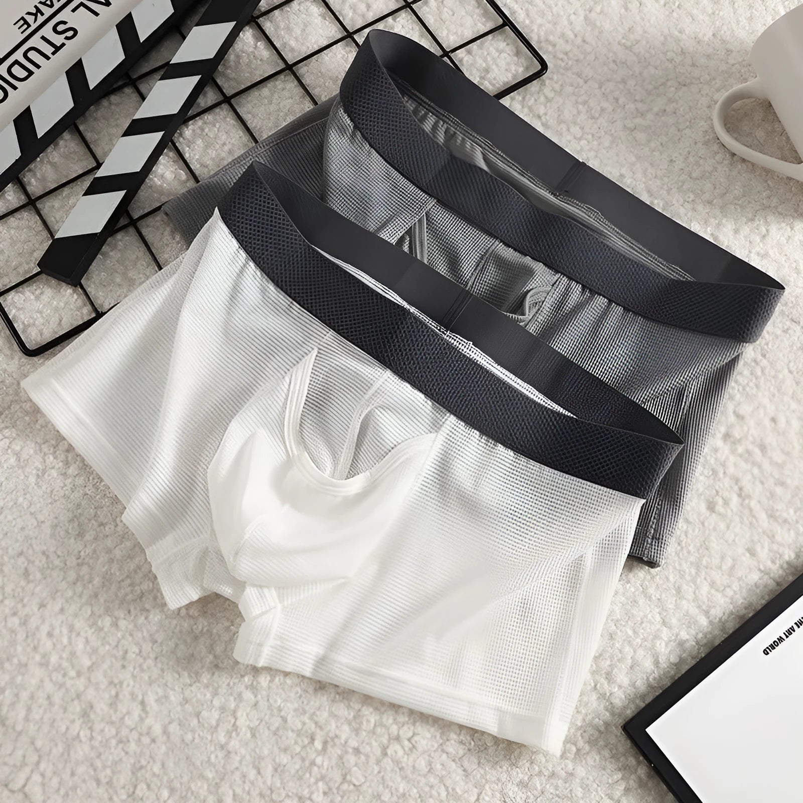 Men's ice silk nylon boxer underwear in black colour showing low-waist design and mesh breathable panels