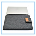 Khaki felt laptop bag showing clamshell design with interior device protection