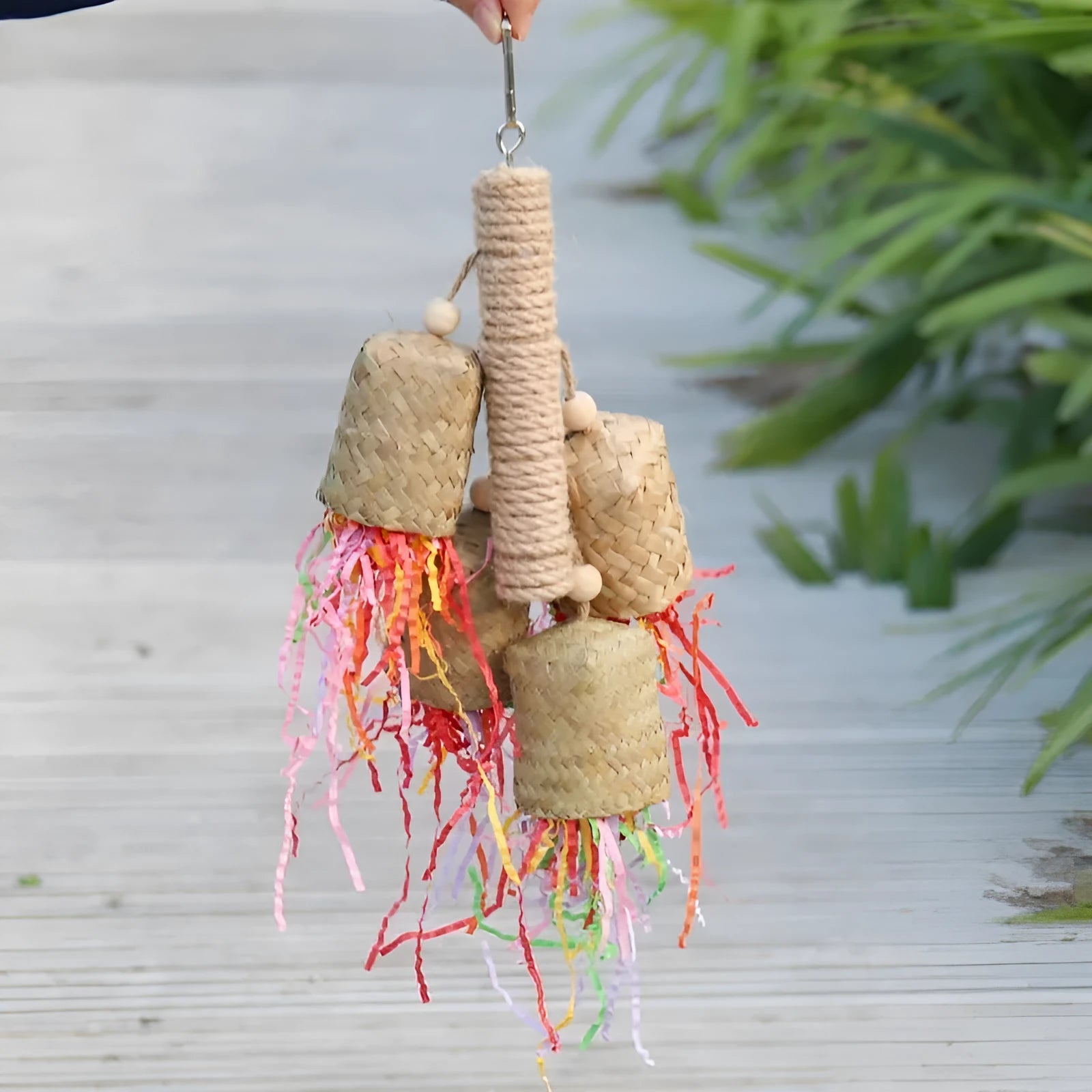 Colourful wood and sisal rope parrot foraging toy measuring 15cm by 35cm