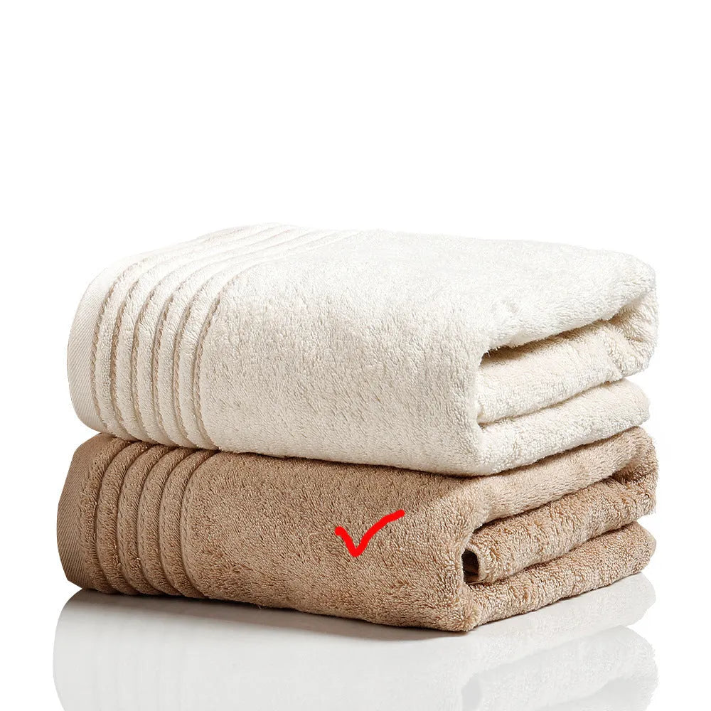 Cotton towel set showing three sizes in beige and brown colours for bathroom use