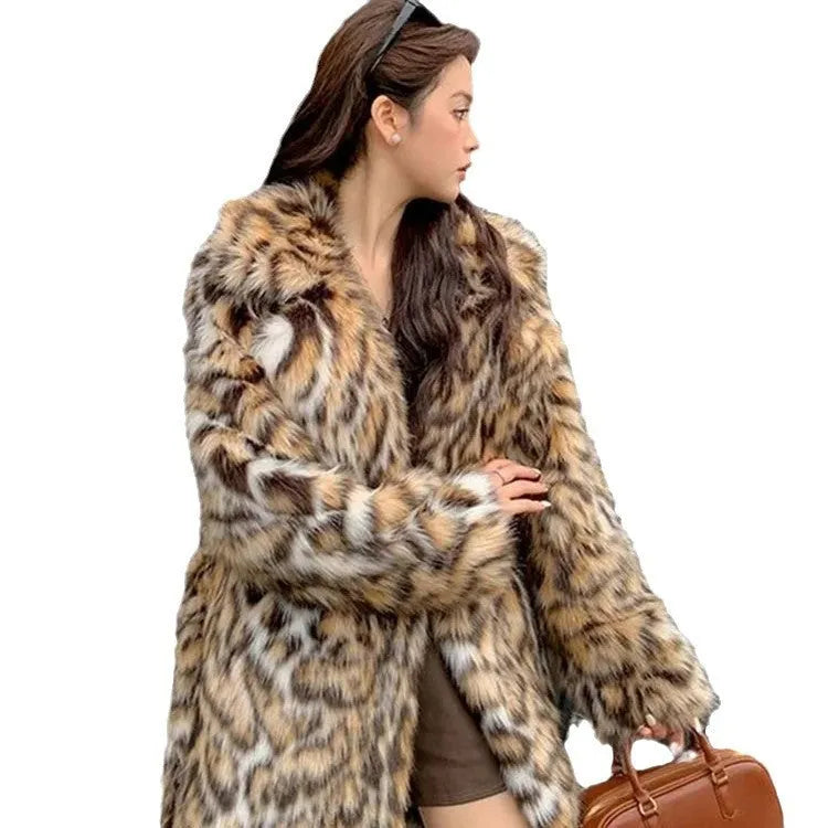 Long faux fur coat with fur collar and pockets in artificial fur fabric