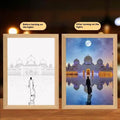 Modern rectangle LED light painting frame with illuminated artwork on man-made board.