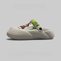 Men's grey EVA sole beach hole shoes on a sandy background