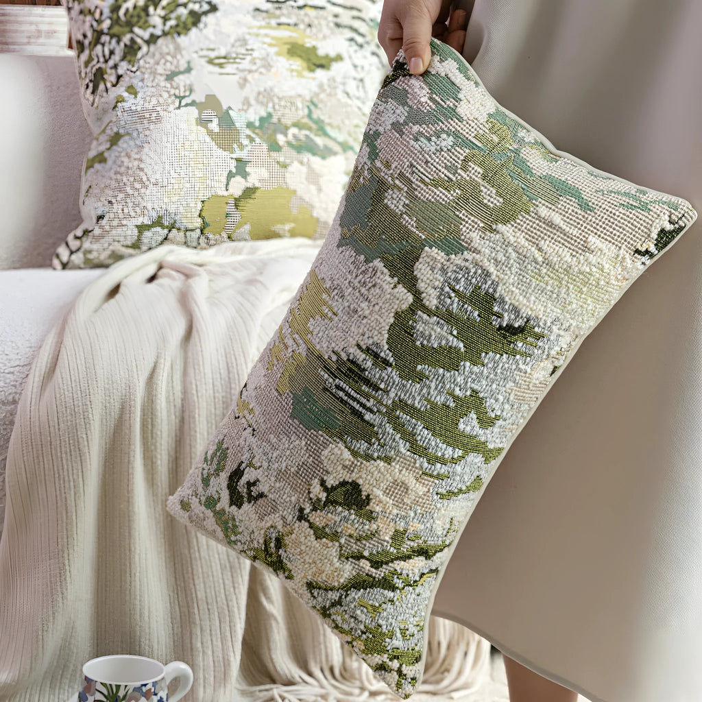 Antique green wool blend cushion with abstract spring flower botanical pattern.