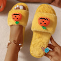 White and yellow Halloween cartoon pumpkin plush open-toe slippers on anti-slip PVC sole.