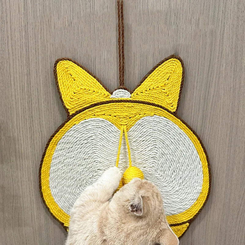 Yellow Corgi butt design sisal cat scratching pad with anti-slip base on a wooden floor.