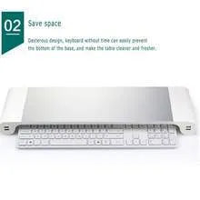 Aluminium and plastic computer monitor stand with four USB ports and hidden keyboard storage underneath