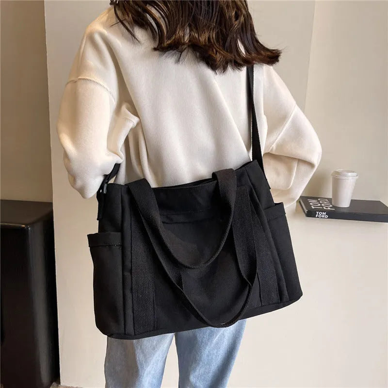 Large capacity canvas shoulder bag with sandwich pocket design in solid colour options