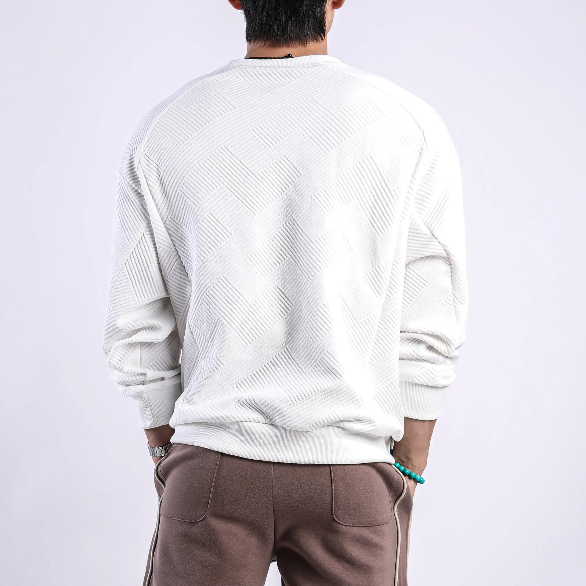 Men's loose fit long-sleeved twill jacquard sweater in Army Green, shown with round neck and regular sleeves.