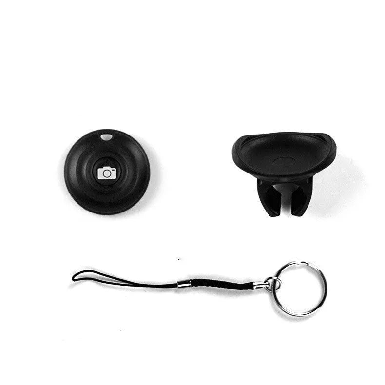 Black Bluetooth selfie remote with a clip-style snap grip for handheld or mounted use.