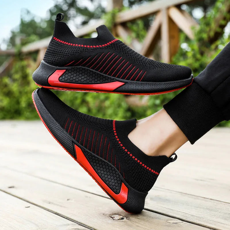 Men's black and white striped mesh sock sneakers with lace-up front and round toe.