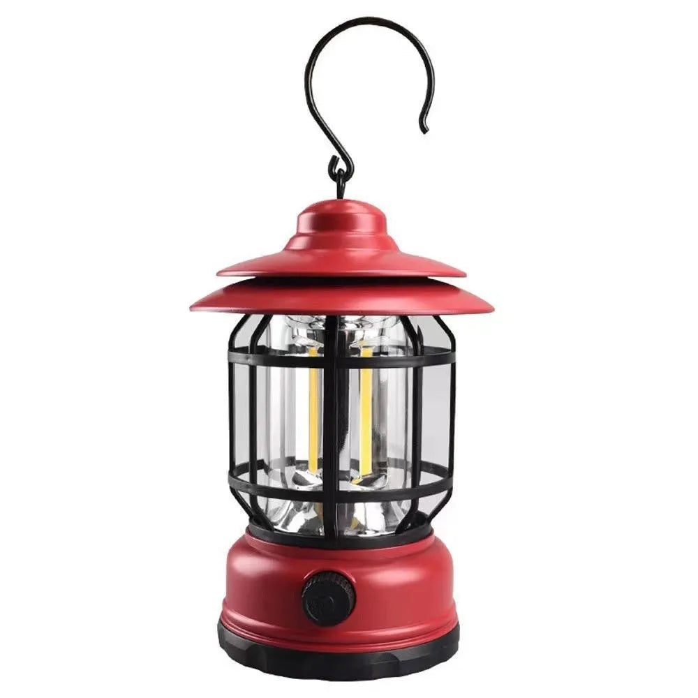 Dark green portable camping lantern with head strap, shown as a headlamp and standalone light for booths.