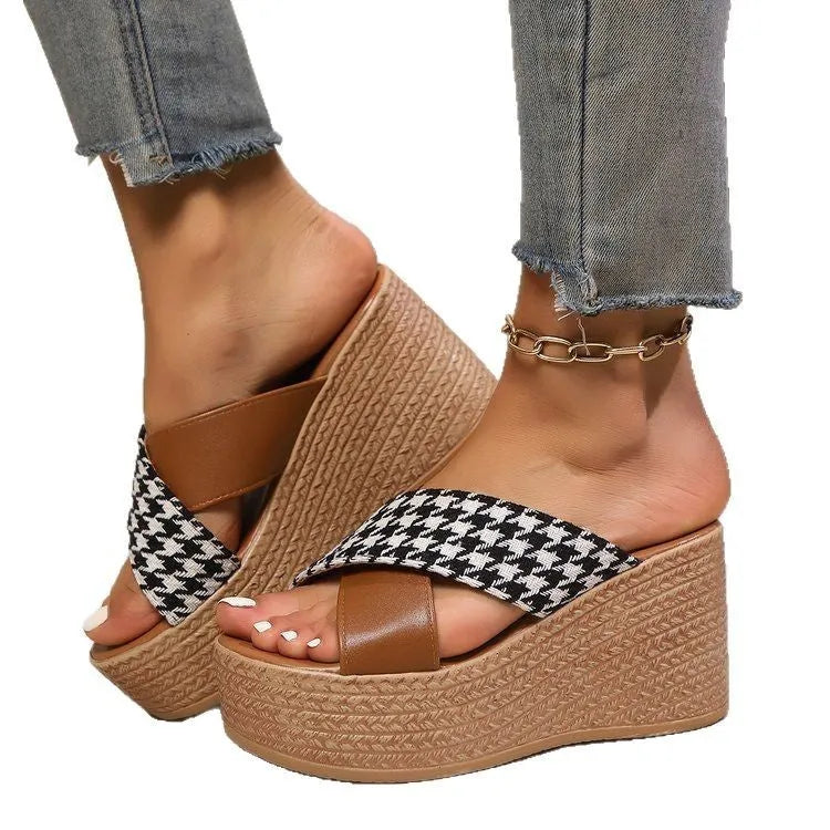 Casual brown and black plaid wedge sandals with a non-slip rubber sole.
