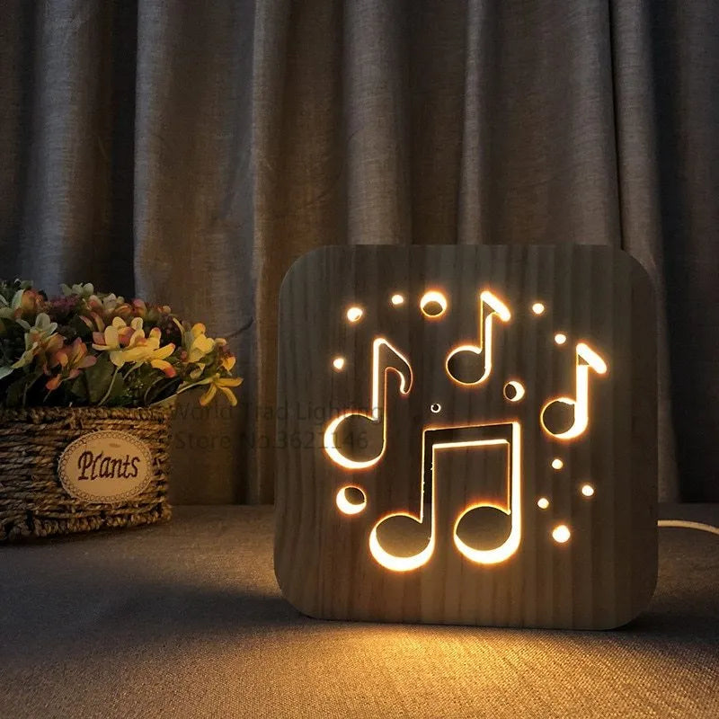 A cubic wooden LED atmosphere lamp with warm white light, shown with a USB cable.