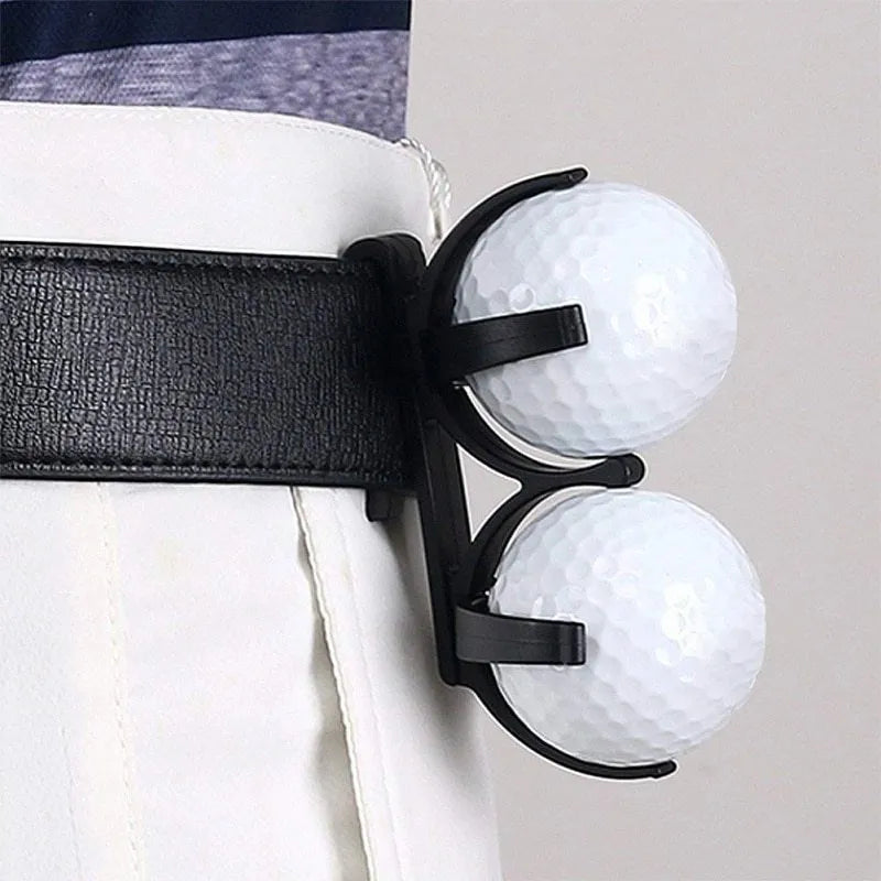 Black plastic golf ball holder clip for belt or bag, holds two golf balls, approx 8 x 4.2 x 1cm