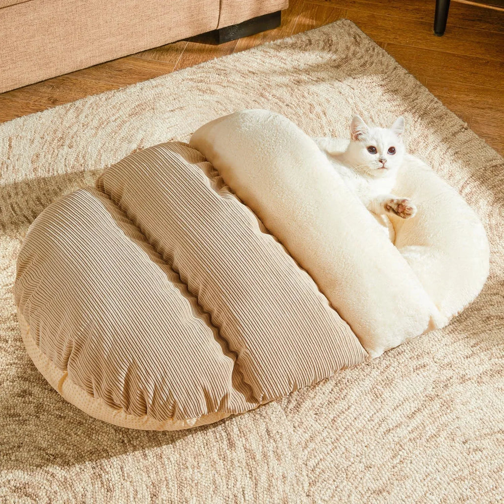 Slipper-shaped cat bed with corduroy exterior shown in closed cave configuration and opened flat position