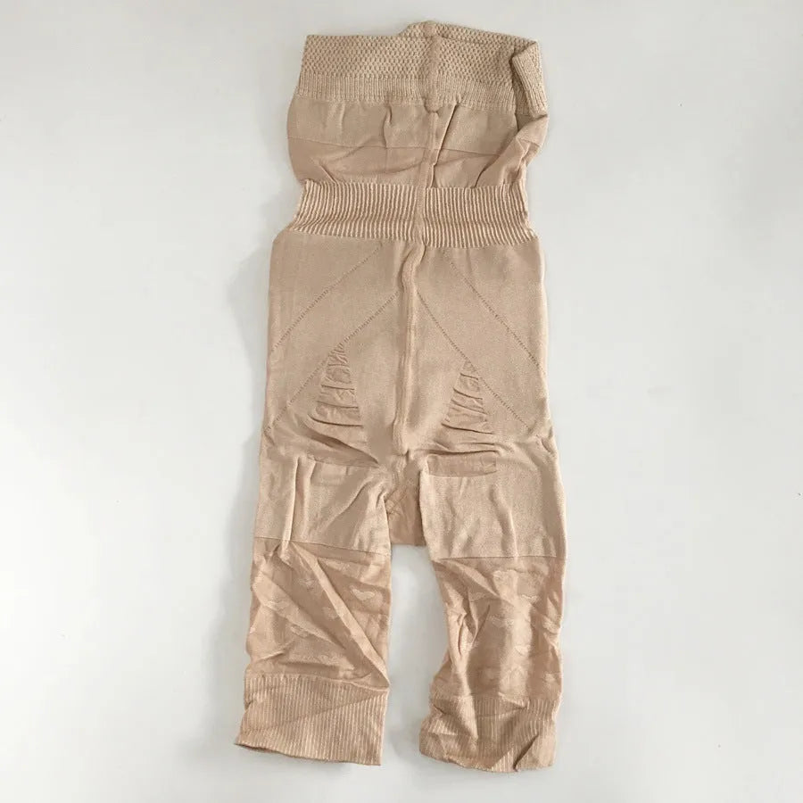 Women's high-waisted seamless shapewear shorts in black on a mannequin, showing tummy control design.