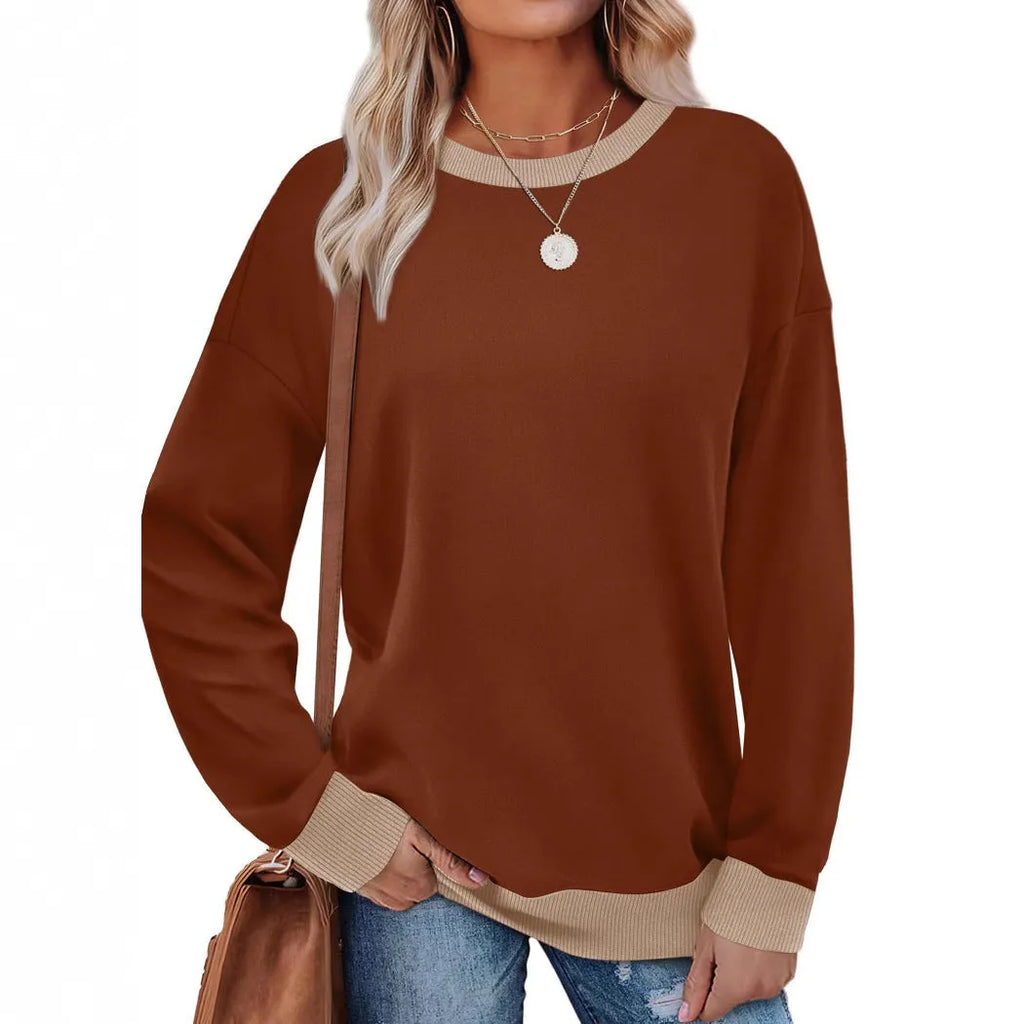 Women's loose striped long-sleeved top in polyester showing round neck and regular sleeve construction