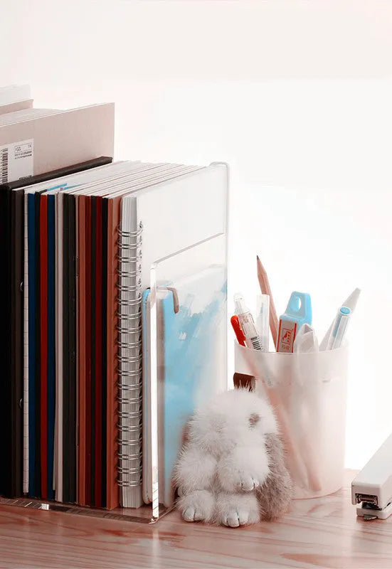 Transparent acrylic bookshelf displaying two books with smooth edges and clear plexiglass construction