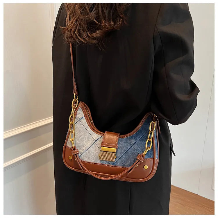 Brown denim women's bucket shoulder bag with diamond mesh panels and chain straps