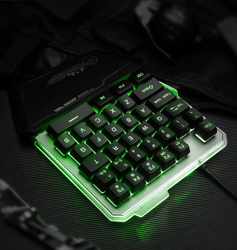 G40 Flow black one-handed robotic keyboard with RGB backlight on a desk.